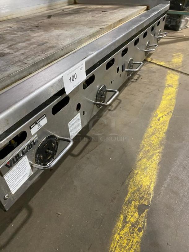 Vulcan stainless steel natural gas countertop flat griddle with thermostatic control, back & side splash, and sturdy legs.