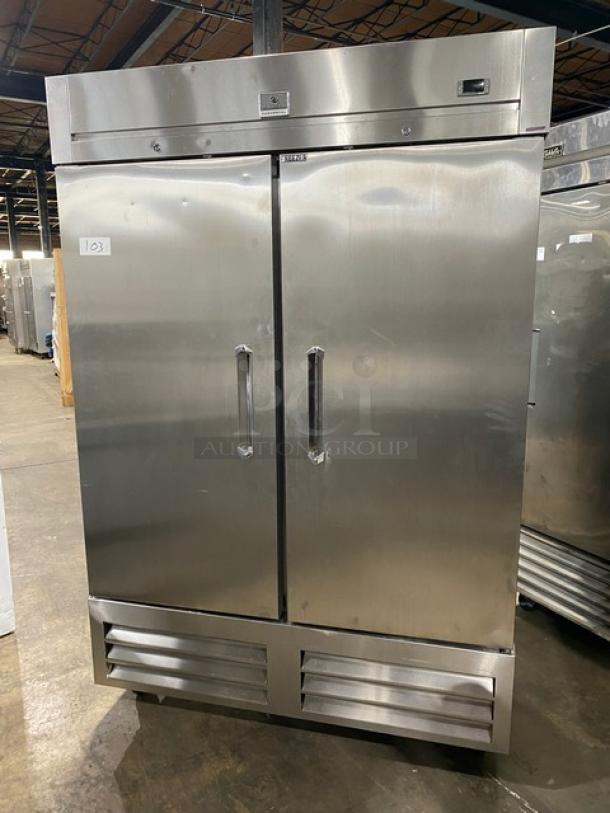 Kelvinator stainless steel 2-door commercial freezer, model KCHRI54R2DFE, SN: 23220028, with poly-coated wire rack and casters.