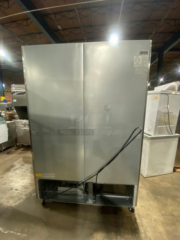 Kelvinator stainless steel 2-door freezer, model KCHRI54R2DFE, on casters, with poly-coated rack, 115V, SN: 23220028.