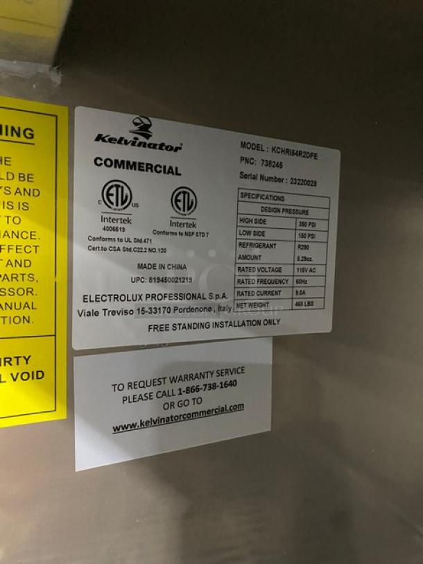 Kelvinator Commercial Stainless Steel 2 Door Freezer, Model KCHRI54R2DFE, SN: 23220028, 115V, on casters. Includes poly coated wire rack.