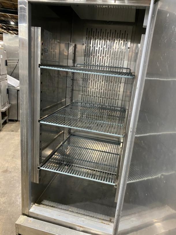 Kelvinator stainless steel reach-in freezer, model KCBM23FSE, Energy Star certified, poly-coated wired rack, on casters.
