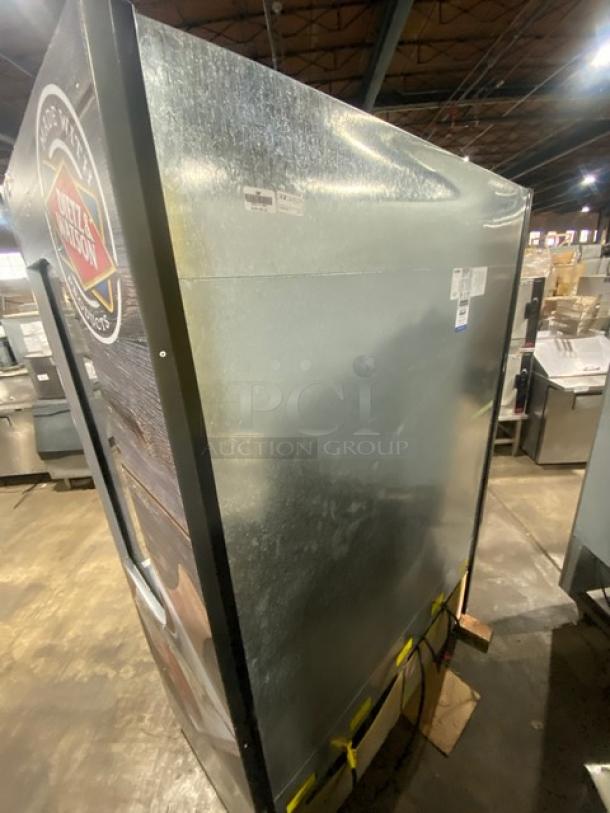 Ojeda ALPA120G2 refrigerated display case, vertical open design, Dietz & Watson branding, good condition, 120V, 1 phase.