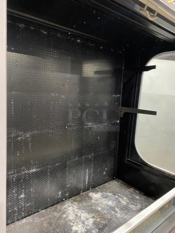 Ojeda ALPA120G2 refrigerated grab-n-go merchandiser with signs of use, model and serial numbers visible inside.