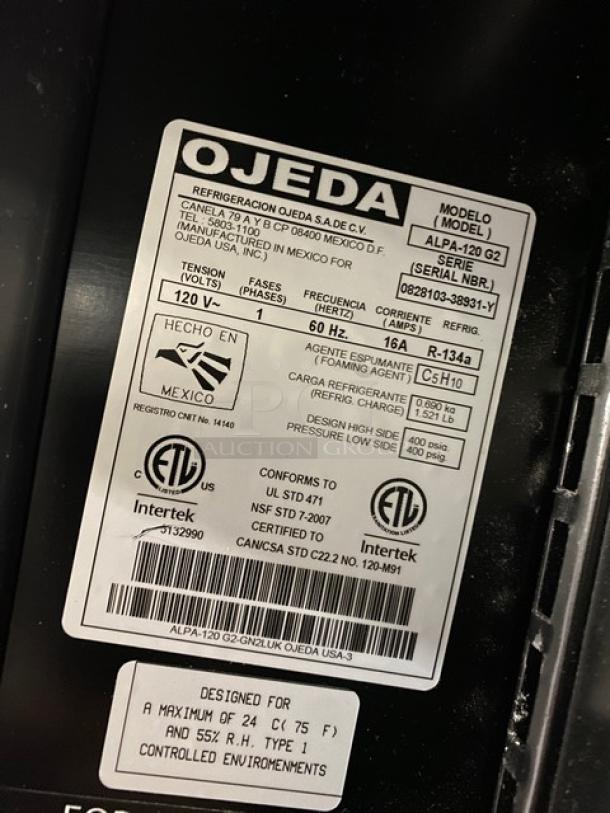 Label on Ojeda ALPA-120 G2 refrigerated display case, showing model number, serial number, 120V, and certifications.