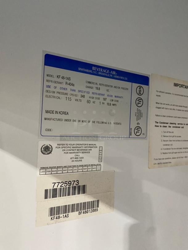 Beverage-Air stainless steel 2-door reach-in freezer, model KF48-1AS, SN BF48012089, 115V, on casters, labels visible.