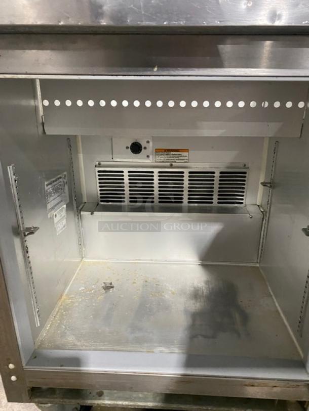 Beverage-Air Elite Series SPE27 refrigerated prep table, stainless steel, single door, bain marie style, on casters, interior view.