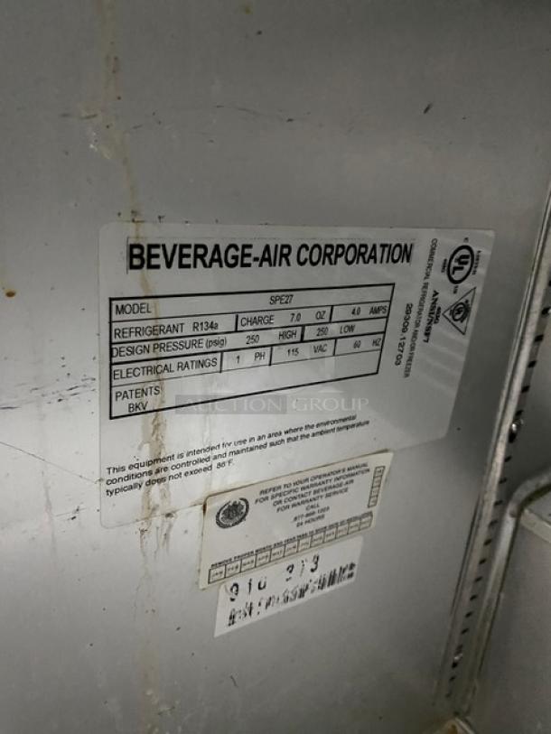 Beverage-Air SPE27 label showing model, refrigerant details, design pressure, and electrical ratings. 115V, 1 phase.