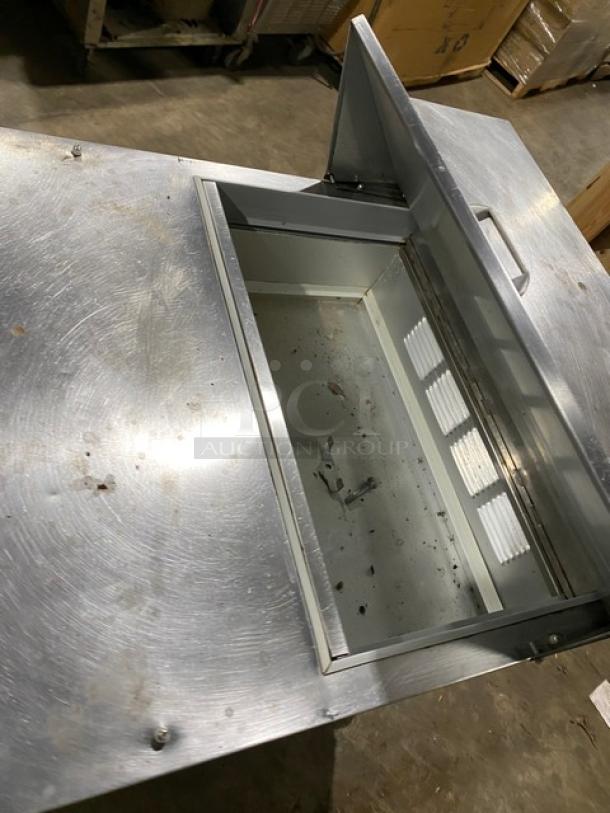 Beverage-Air Elite Series commercial stainless steel refrigerated prep table SPE27, single door, on casters, used condition.