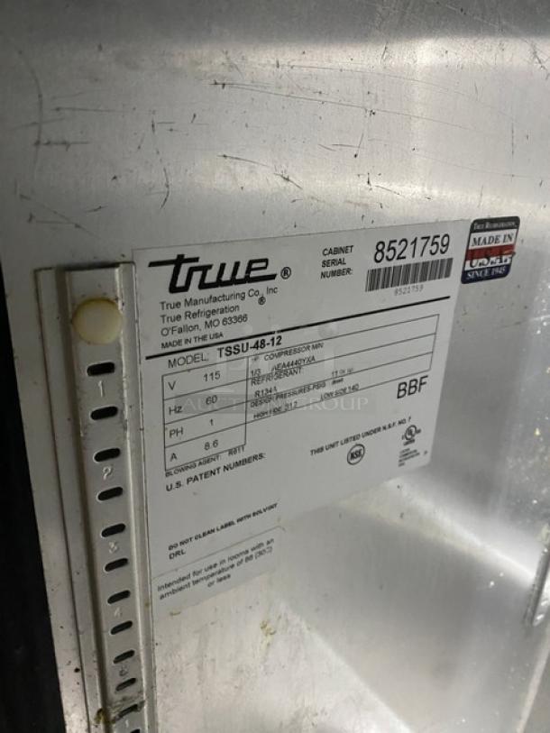 True TSSU-48-12 stainless steel refrigerated prep table, SN: 8521759, 115V 1 Phase, on casters, label shown.