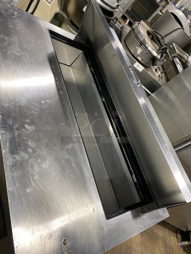 True TSSU-48-12 stainless steel 2-door prep table, refrigerated, bain marie style, on casters, model view, used condition.