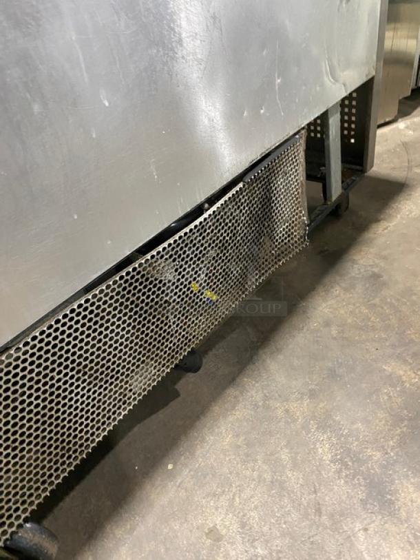 True TSSU-48-12 stainless steel 2 door refrigerated prep table with damaged vent cover, on casters, 115V, 1 Phase.