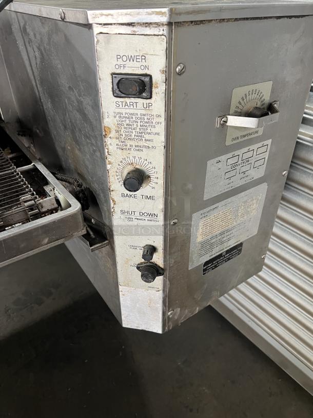 Lincoln Impinger 1400 Series Model 1451 commercial conveyor oven, stainless steel, liquid propane, 120V 1 Phase, on casters. Visible control panel with power and bake settings.