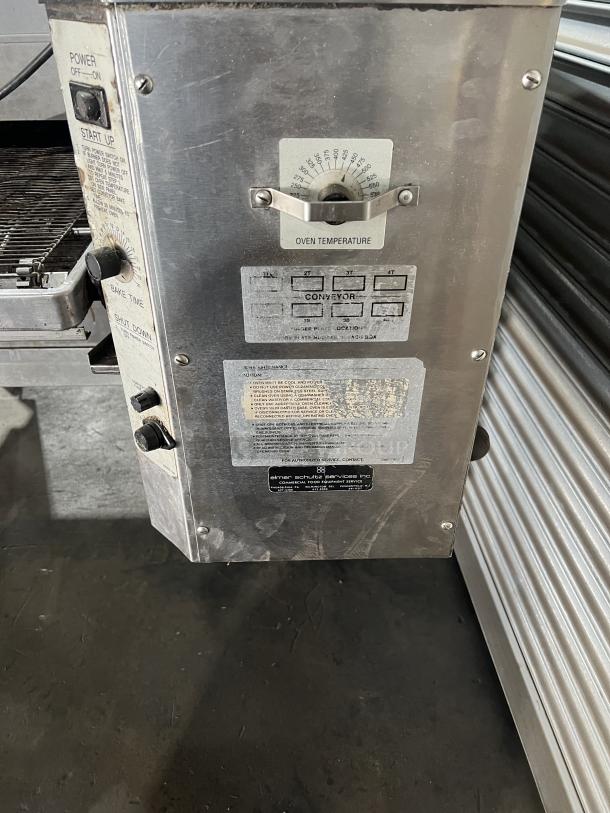 Lincoln Impinger 1400 Series Model 1451 commercial conveyor oven, stainless steel, liquid propane, 120V, on casters, control panel detail.