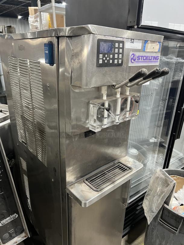 Stoelting O431-10912F-R stainless steel twin/twist soft serve machine, drip tray, 208-240V, 3 phase, on casters, gently used.