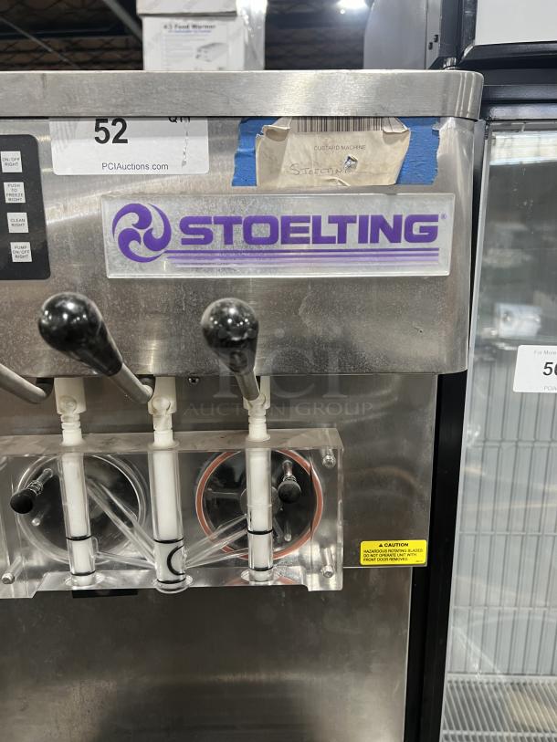 Stoelting stainless steel soft serve machine, model O431-10912F-R, electric, twin/twist. Includes drip tray, on casters.