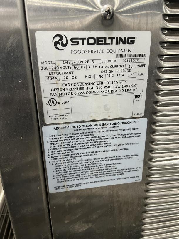 Stoelting twin/twist soft serve machine O431-10912F-R, stainless steel, electric, 208-240V, 3-phase, on casters, with drip tray.