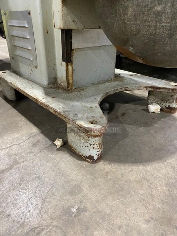 Reynolds 1060 60 Qt. Planetary Mixer base, showing rust and wear. Equipped with mixing bowl, dough hook, and sturdy legs.
