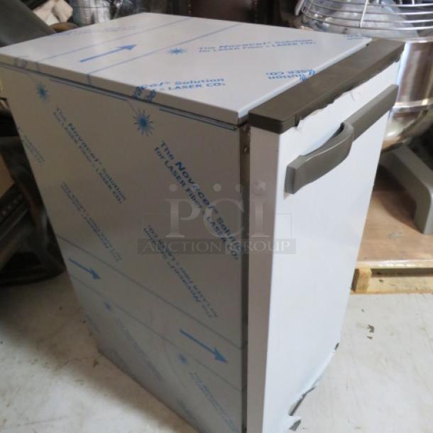 Manitowic Under Counter 53lb Ice Maker, Model SMS050A002-161, new, 115V, dimensions 15x24x33.5 inches, protective wrapping visible.