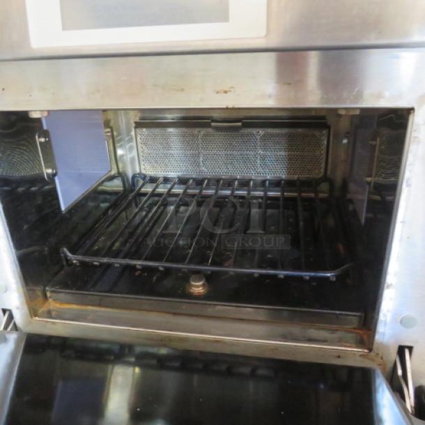 Merry Chef Eikon E4 convection oven, 208/240V, stainless steel, 23"x28"x23", high-speed, gently used condition.