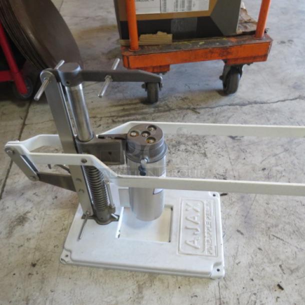 AJAX Pineapple Peeler with mechanical arms, white base, spring mechanism, model markings clear, in used condition.