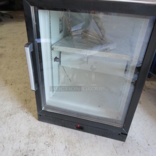 New Aegis Model 2-F-5 glass display freezer with 1 door, includes 3 racks and keys. Measures 23x25x30.5 inches. 115 Volt.