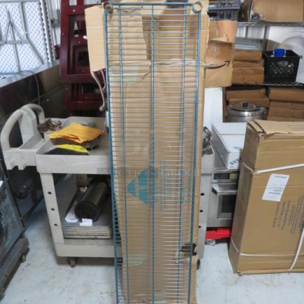 NEW 60x14 green Metro shelf, in packaging, from METRO. Appears pristine, ideal for storage solutions. Model: 2XBID.