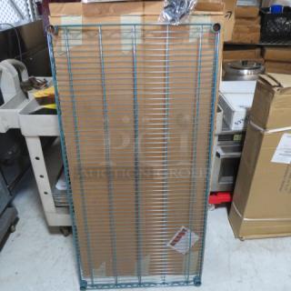 NEW 48x24 Green METRO Shelf, sealed packaging, includes mounting hardware, ideal for durable storage solutions.