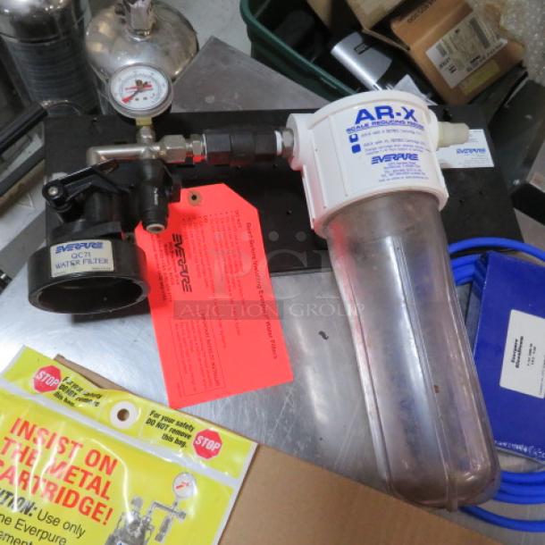 Everpure water filtration system with AR-X model, visible pressure gauge, and original tags. Appears unused.