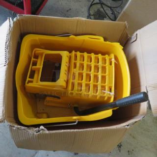 Winco MPB36 mop bucket and wringer, new in box. Bright yellow plastic, sturdy wringer, ergonomic handle.