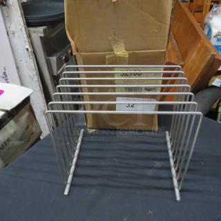 New stainless steel Vollrath pan rack, model 52100. Six slots, durable construction, original packaging visible.