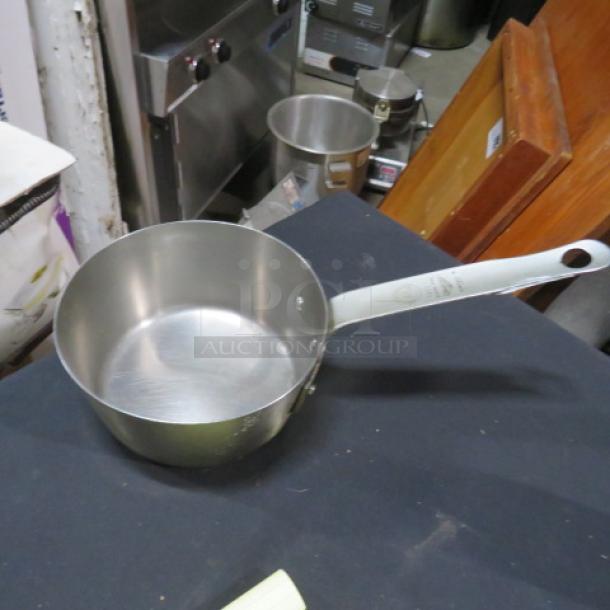 Vollrath 2 Quart Sauce Pan, Model 78321, stainless steel, sturdy handle. In good condition, ideal for cooking needs.
