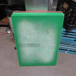 24x18 green cutting board, used condition, visible surface scratches, stacked on pallets.