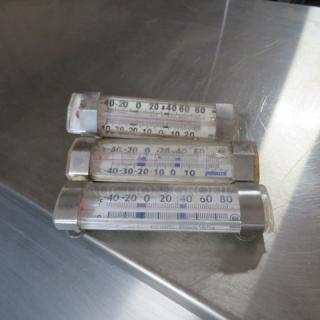Assorted thermometers, three pieces, marked Pelouze. Clear casing, temperature range -40 to 80 degrees. Used condition.