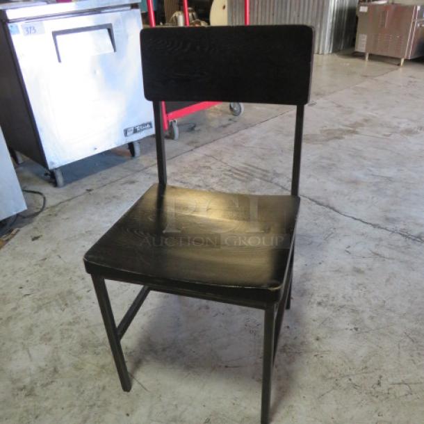 Black metal and wooden chair, model 2XBID; features sleek design, sturdy build; good condition, minimal wear.