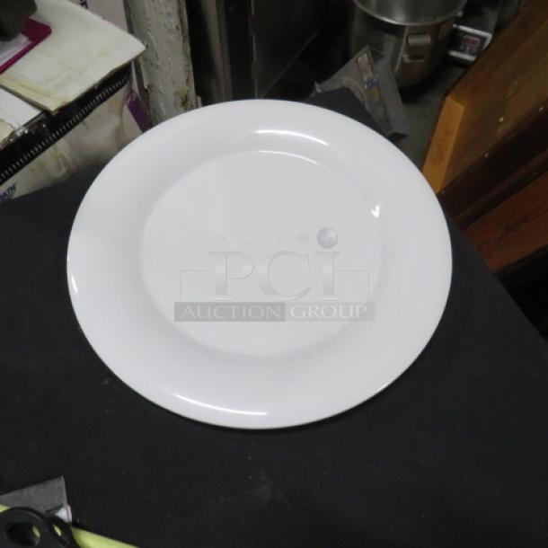White Carlisle 12-inch plate, model N33024, new condition, smooth surface, ideal for dining settings.