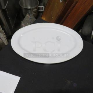 13.5x9.5 Prolon platter, model #NSF-36. White, oval, gently used. Smooth surface, suitable for serving.