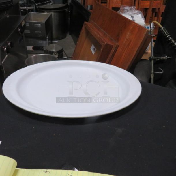 15x10.5 Prolon platter, model #9614. White, round with a subtle lip. Used condition, ideal for serving.