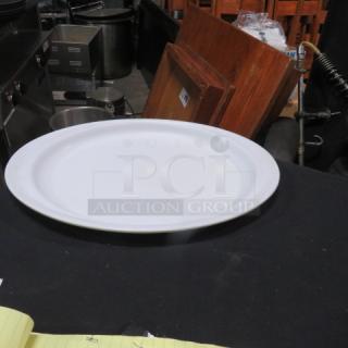 15x10.5 Prolon Platter, model #9614, white, used condition, suitable for serving or display, on black table surface.
