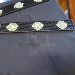 Black Nelsons Whiskey bar mat with green and white logo repeating, in excellent condition. Perfect for bar counters.
