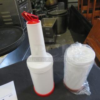 NEW Store And Pour set, includes two white containers with red spouts, one wrapped in plastic. Perfect for liquid storage.