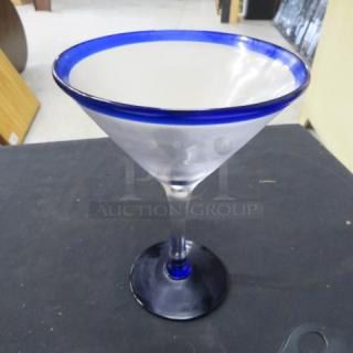 Beautiful new martini/margarita glass with blue rim and base, clear body, excellent condition. Ideal for collectors or entertaining.