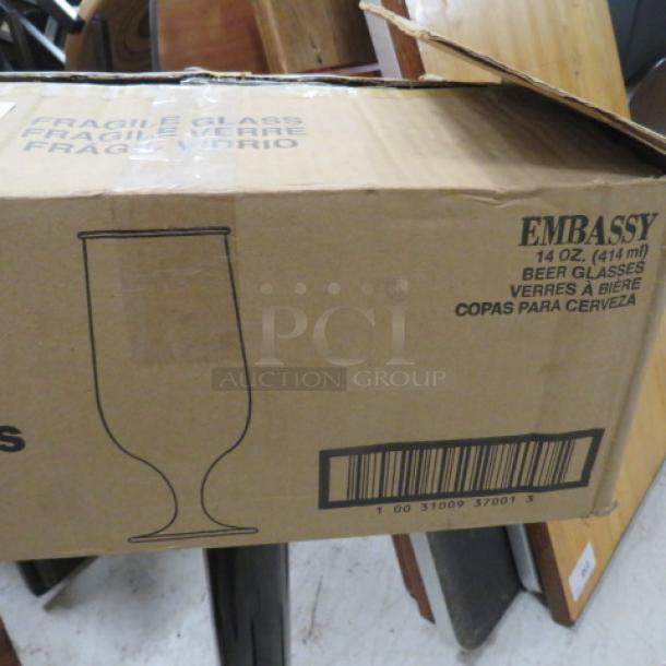Box of NEW Libbey 14oz Embassy Stem Beer Glasses, 12 pieces, labeled "Fragile Glass." Bar code visible.