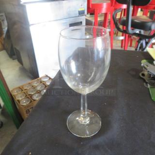 NEW Libbey 10.25oz stem wine glass on black surface, clear and unused.