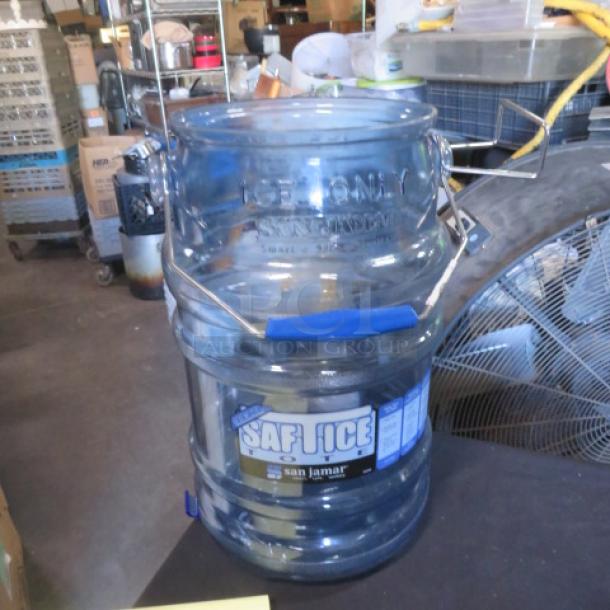 San Jamar Saf-T-Ice bucket, transparent with blue handle, "Ice Only" label. Used condition, warehouse setting.