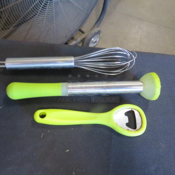 Lot of bar tools includes a metal whisk, lime green muddler, and matching bottle opener. Good condition.