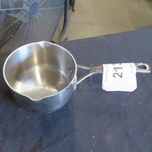 Stainless steel Sir La Table saucepan, gently used, sturdy handle, visible auction tag with number 213.