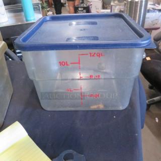 12 Quart food storage container with lid, clear plastic, blue lid, red measurement markings, used condition.