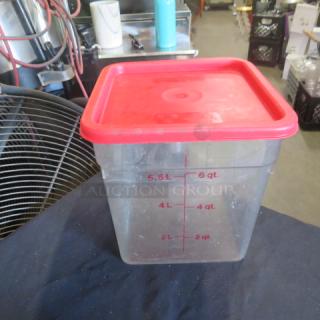 8-quart food storage container with red lid, clear plastic, marked with measurements up to 6 quarts.