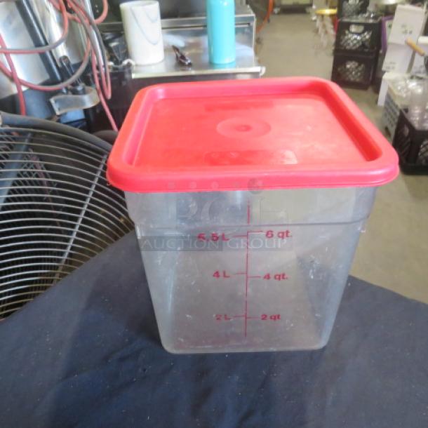 6-quart food storage container with red lid, marked measurements in quarts and liters, good condition.
