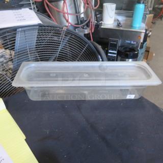 Clear 1/2 size long food storage container with lid, 4 inches deep. Suitable for kitchen storage. Good condition.